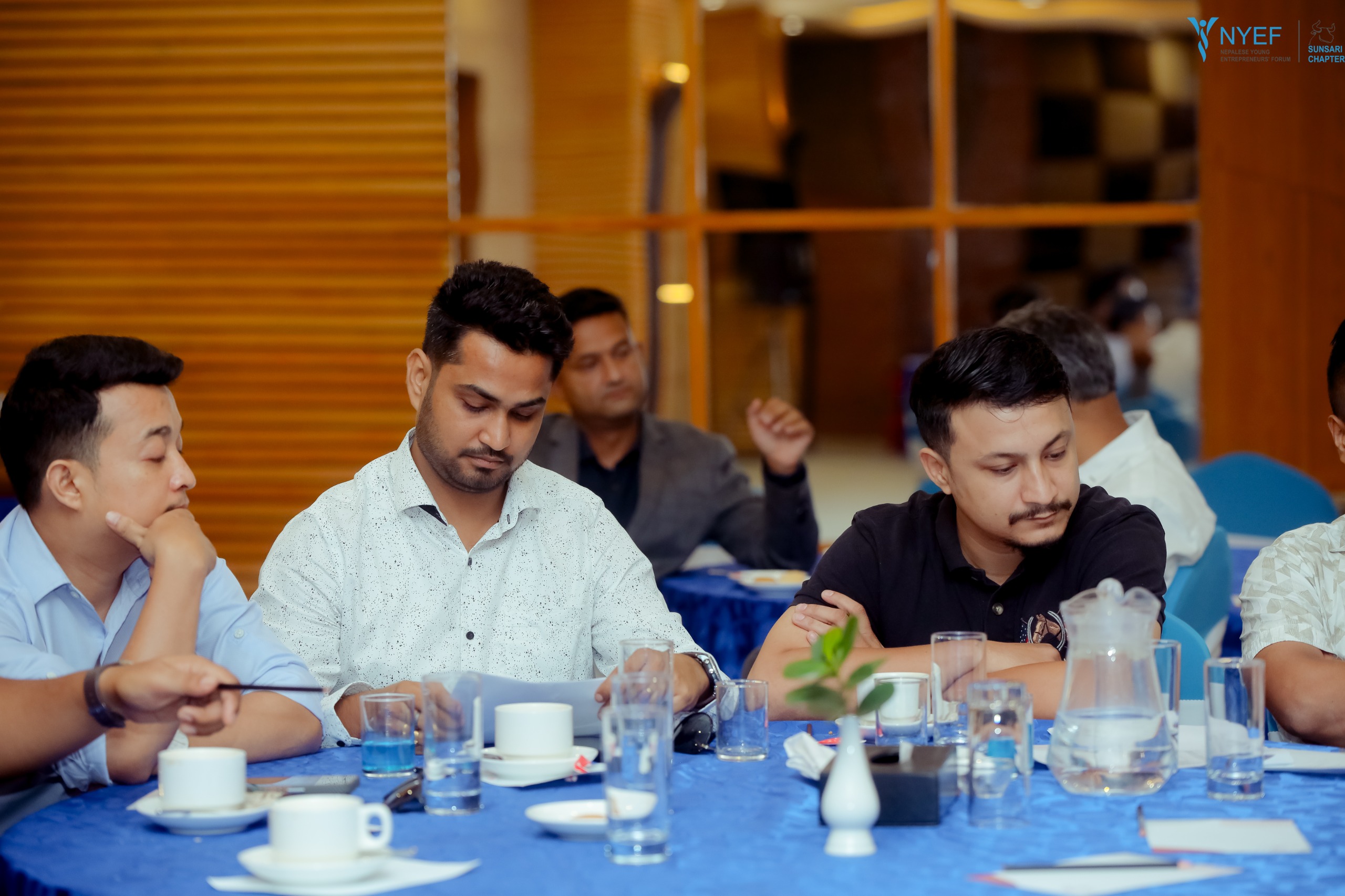 NYEF members collaborating in a meeting